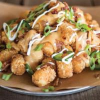 Loaded Taters · Tater tots loaded with our Amber Ale beer cheese & topped with fresh jalapeños, applewood sm...