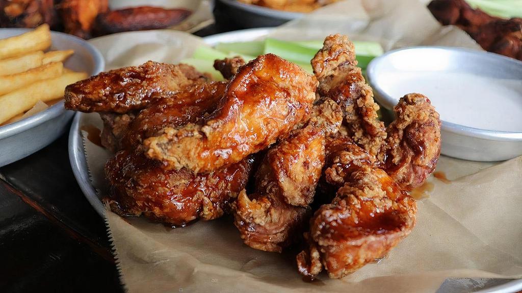 Boneless Wings · Hand-breaded, crisp chicken breast tenders, served with celery and your choice of house-made blue cheese or ranch.