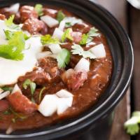 Signature Chili · Our rich & savory steak, chorizo & red bean chili is spiced up with roasted red chilies. Ser...