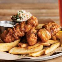 Beer-Battered Fish & Chips · American Blonde beer-battered crispy cod served with coleslaw, choice of side & house-made t...