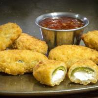 Jalapeño Poppers · Jalapeños stuffed, breaded, and fried to golden perfection.