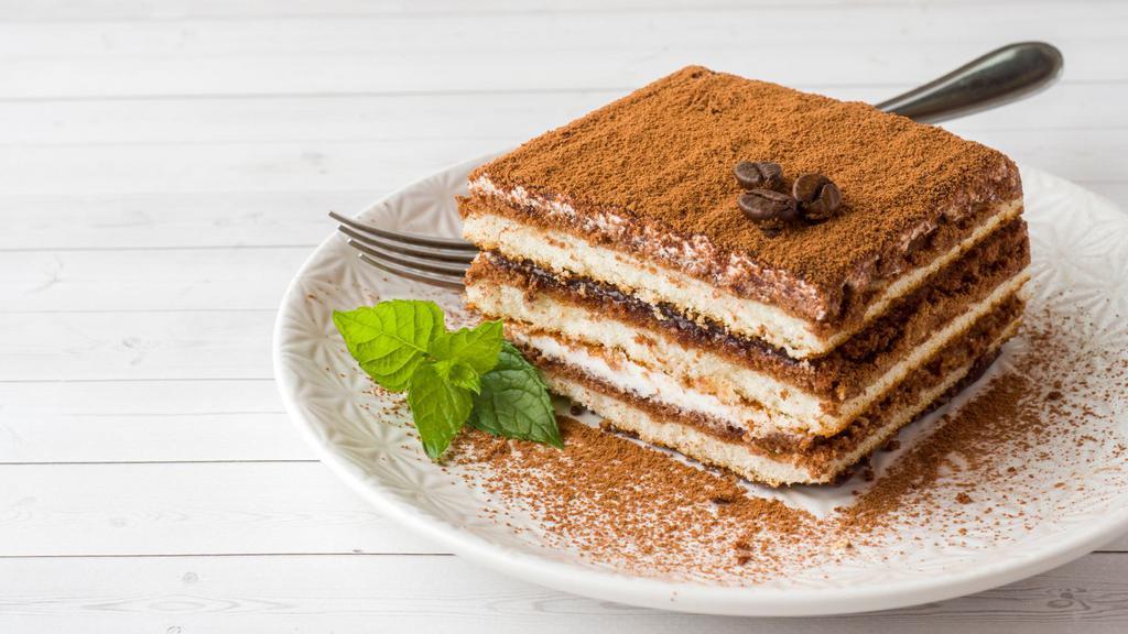 Tiramisu · Fluffy cake layered with cream and seasoned with cocoa and coffee.