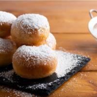 Zeppoli · Italian fried dough covered in powdered sugar.