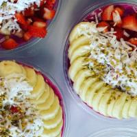 The Frutta Bowl · Base: pitaya, banana, strawberries, raspberries, almond milk, topped with banana, strawberri...