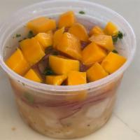 Mango Ceviche · Cooked fish ceviche marinated in lime juice topped with mango. Serve with chulpe corn.