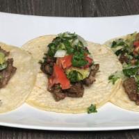 Steak Tacos · Marinated in spices grilled to perfection, top quality steak