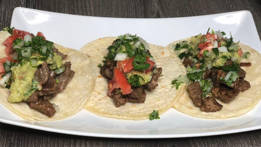 Steak Tacos · Marinated in spices grilled to perfection, top quality steak