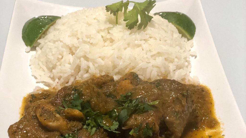 Goat Stew · Goat stew with rice and sweet plantains