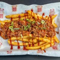 Chill N Fries · Served with melted cheese, pulled pork, and green onions.