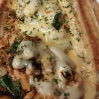 Salmon Philly · Grilled Salmon with spinach Peppers Onions and our Seafood Mornay Sauce topped with House Re...