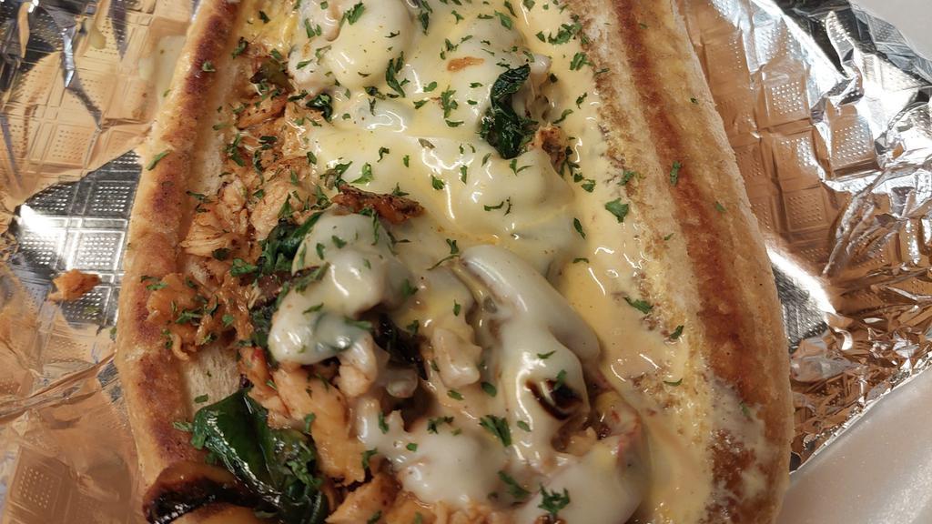 Salmon Philly · Grilled Salmon with spinach Peppers Onions and our Seafood Mornay Sauce topped with House Remoulade 6 inch. Add Fries and Soda for an additional charge.