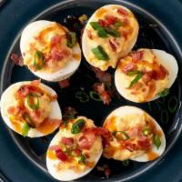 Deviled Eggs · Six classic deviled eggs, topped with bacon & green onions, drizzled with bourbon BBQ sauce ...