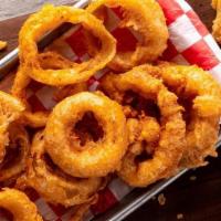 Beer-Battered Onion Rings · Hand-battered in our house-made Bud Light batter & served with Texas petal sauce.