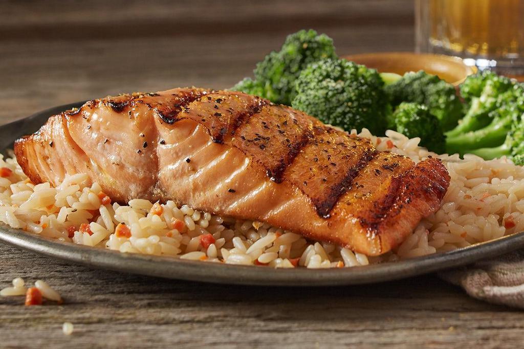 Mesquite Wood-Grilled Salmon · 8 oz. salmon fillet served over Roadhouse Rice with garlic dill sauce.