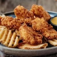 Twisted Chicken Tenders · Chicken tenders marinated in buttermilk for 24 hours and breaded in our Twisted seasoned flo...