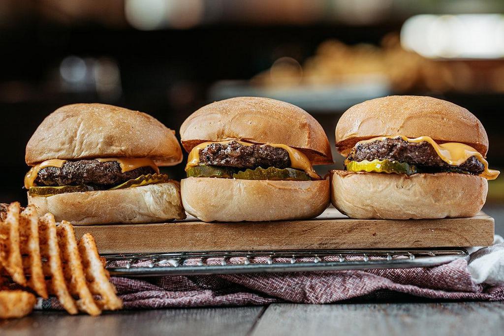 Original Roadies® · Three mini steakhouse burgers topped with American cheese and pickles on our signature yeast rolls.