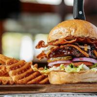 Roadhouse Deluxe* · Served with thick-cut hardwood smoked bacon, signature Roadhouse BBQ sauce, shredded cheddar...