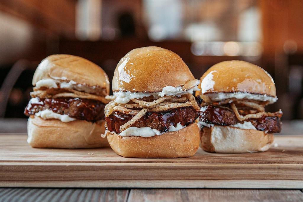 Meatloaf Roadies® · Three mini meatloaf sliders with mashed potatoes, crispy onions & BBQ sauce on our signature yeast rolls.