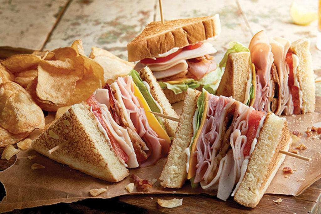 Logan'S Club Sandwich · Ham, turkey, bacon, lettuce, tomato, mayo, Swiss and cheddar cheeses served on Texas toast.