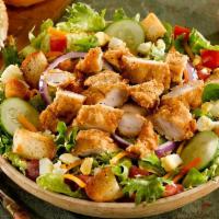 Party Pack Fried Chicken Salad · Crispy, hand-breaded chicken tenders served over mixed greens, tomatoes, cheddar cheese, red...