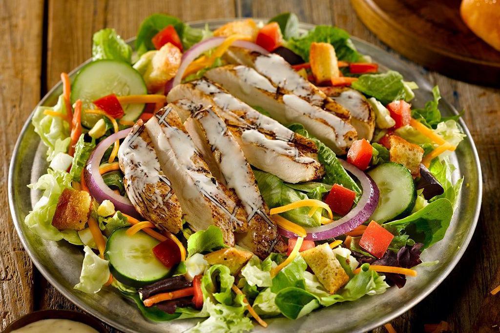 Mesquite-Grilled Chicken Salad · Mesquite-grilled chicken smothered with our Parmesan Peppercorn dressing & served over mixed greens, tomatoes, cheddar cheese, red onions, cucumbers, hard-boiled egg and croutons.