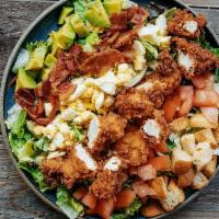 Roadhouse Fried Chicken Cobb Salad · Mixed greens, chopped bacon, avocado, tomatoes, hard-boiled egg and croutons topped with fri...