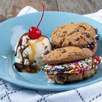 Cookie Slider Sundae · 2 Cookie Sliders - Fudge Brownie coated in sprinkles, sandwiched between fresh-baked chocola...