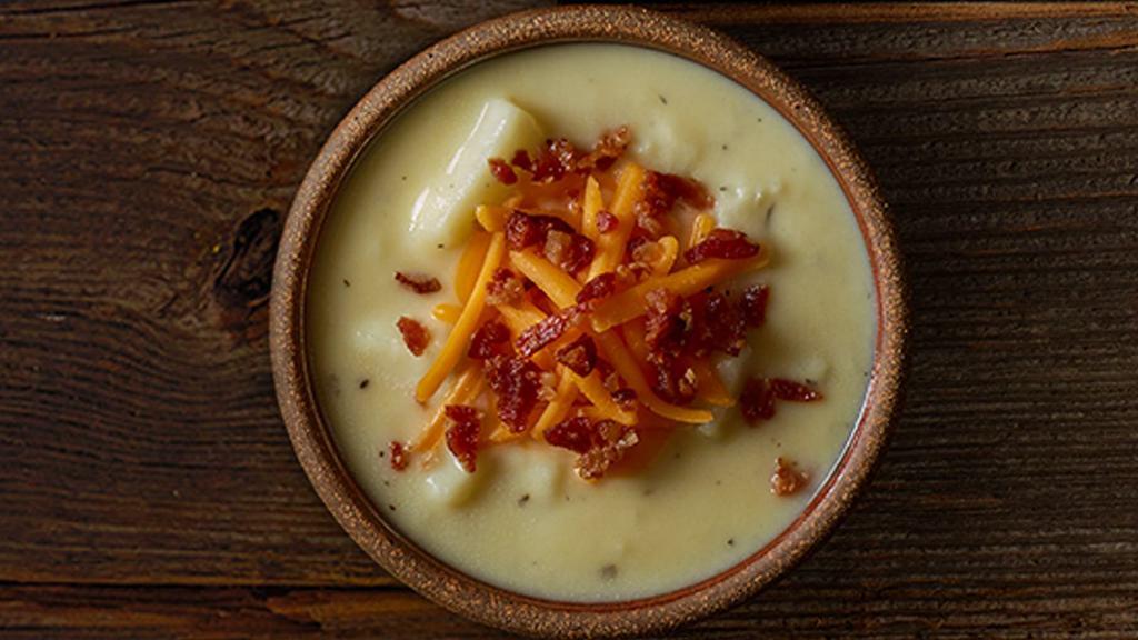 Loaded Potato Soup · Rich and creamy with chunks of potatoes, topped with shredded cheddar cheese and bacon pieces.