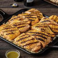 Party Pack Mesquite Wood-Grilled Salmon · Hand-cut salmon fillets grilled over real mesquite wood. Served with garlic dill sauce and g...
