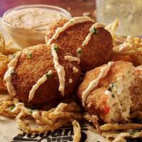 Party Pack Crispy Crab Cakes  · Twelve lightly fried crab cakes served over crispy onions with a side of creamy Cajun sauce....