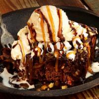 Party Pack Mississippi Brownie · Warm brownie with walnuts, marshmallows and vanilla ice cream with chocolate and caramel sau...