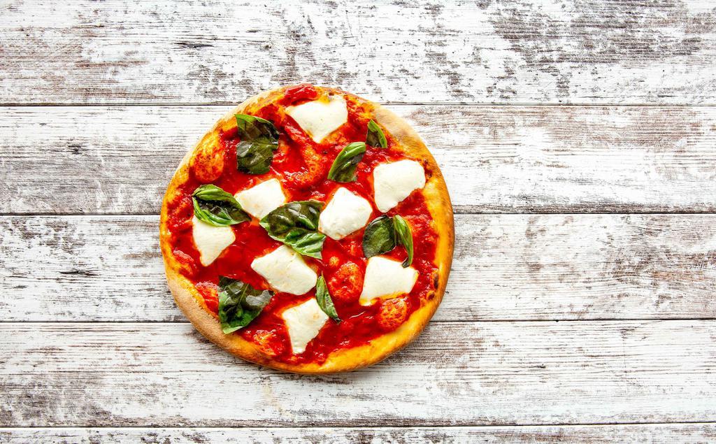 Margherita Pizza · Italian tomato sauce, fully loaded with fresh Mozzarella, fresh basil and a drizzle of olive oil.