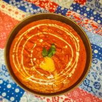 Butter Chicken · Slow simmered authentic style North Indian curry with a tomato, onion, and cream base blende...