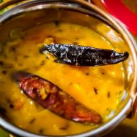 Dal Tadka · Yellow lentil stew cooked with a garlic, tomato and onion base infused with house blended sp...