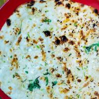 Garlic Naan · Traditional Indian flatbread with garlic and cilantro.