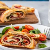 Meat Stromboli · Scrumptious pizza dough turnover filled with pepperoni, ham, sausage, bacon, and salami.