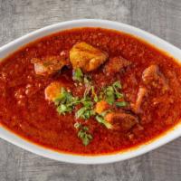 Lamb Vindaloo · A spicy vinegar curry served with potatoes and lamb
