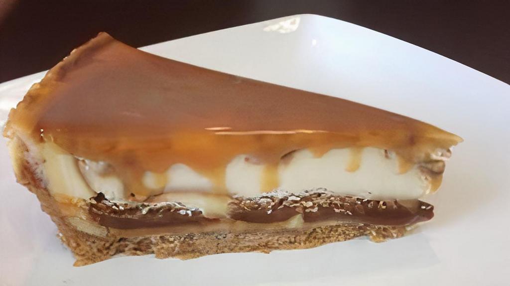 Sea Salt Caramel Cheesecake · We start with our NY Cheesecake and swirl in thick, rich caramel. As if that wasn’t enough we top it with a thin layer of HERSHEY’S® Caramel Topping.