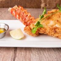 Spicy Fried Lobster Tail · A four ounces. maine lobster tail fried in our signature cayenne and buttermilk batter serve...
