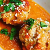 Agave Meatballs · Homemade veal, chorizo, and hatch green chile meatballs in a New Mexico red chile gravy with...