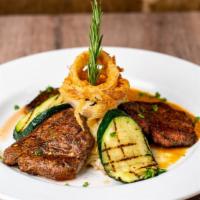 Tenderloin Medallions · Chile rubbed, center cut, fresh tenderloin filet sliced and pan-seared over a roasted tomato...