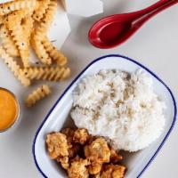 Kids Crispy Chicken Nuggets · Crispy Chicken Nuggets served on White Rice with Sweet N Sour Sauce.