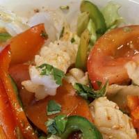 Spicy Salad · Dressed Thai-style with lime juice, chili paste, cucumber, tomato, and scallion, served on a...