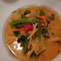 Red Curry · Medium spicy. Red curry cooked with coconut milk, bamboo shoot, broccoli, zucchini, pea carr...