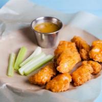 Lemon Pepper Bone-In Wings · Delicious traditional wings tossed in lemon pepper sauce made to perfection and crisp.