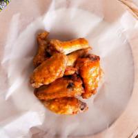 Mild Bone-In Wings · Delicious traditional wings tossed in mild sauce made to perfection and crisp.