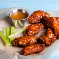Cajun Hot Bone-In Wings · Delicious traditional wings tossed in cajun hot sauce made to perfection and crisp.