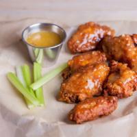 Medium Lemon Pepper Bone-In Wings · Delicious traditional wings tossed in medium lemon pepper sauce made to perfection and crisp.