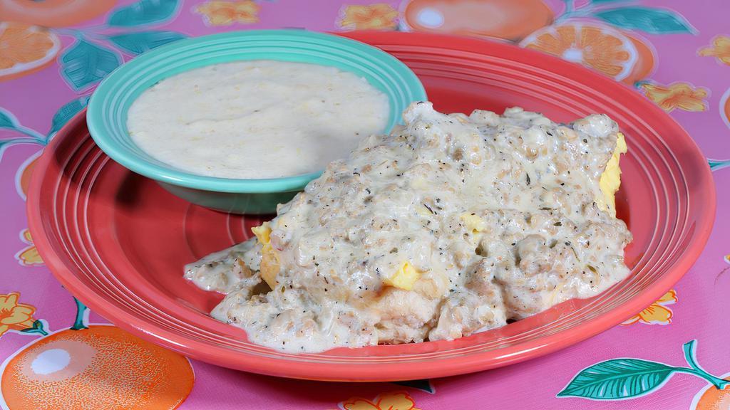 Biscuit, Eggs And Gravy Breakfast · An open-faced fluffy flying biscuit, topped with two scrambled eggs and smothered with our home-made chicken sausage gravy. Served with a side of creamy dreamy grits.