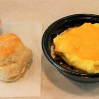 Bacon Grit Bowl · Grits, chopped bacon, one folded egg with American cheese and a fluffy biscuit with cranberr...